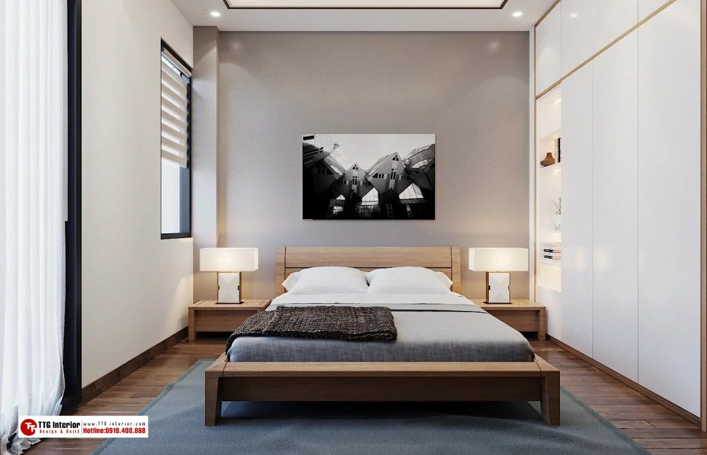 Phòng ngủ tông màu trắng chủ đạo với điểm nhấn là mảng tường màu xám thanh lịch